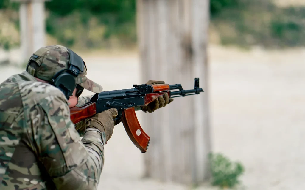 Security professional conducting precision rifle training at a controlled shooting range