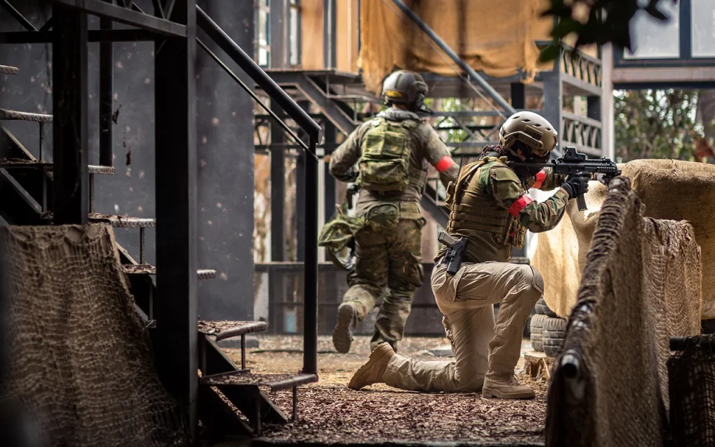 Tactical security team performing close-quarters movement in an urban training environment