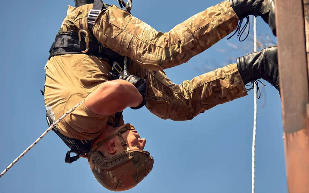 Security specialist performing rope access and vertical insertion training