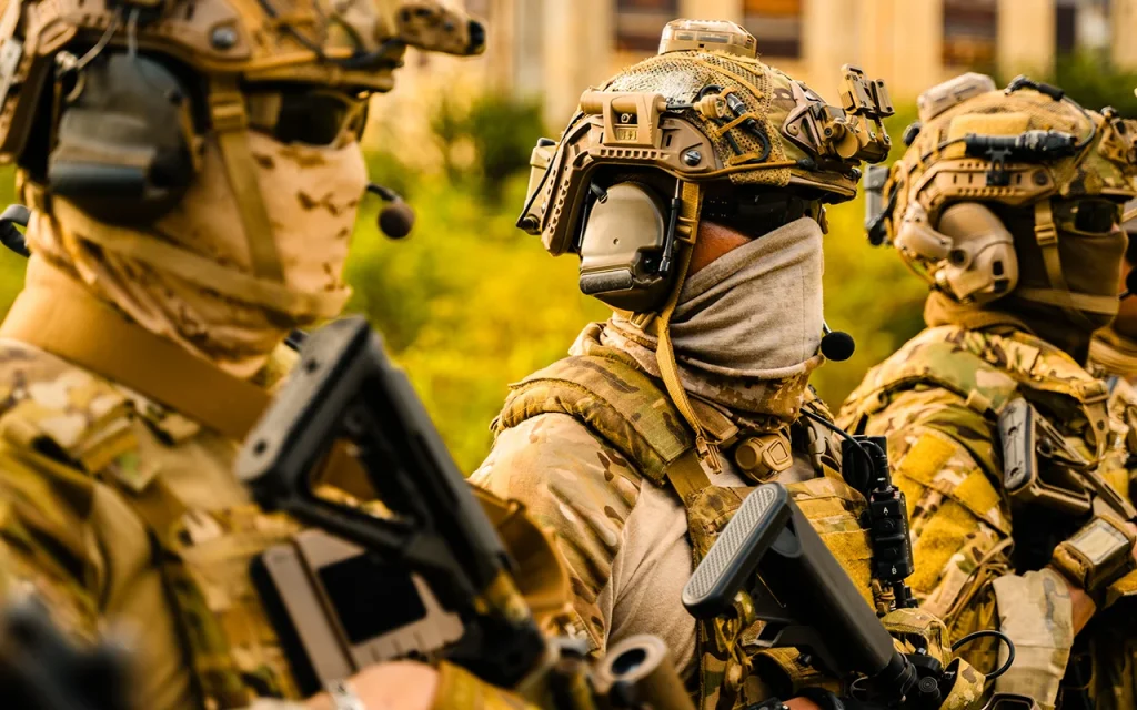 Close protection team equipped with advanced tactical gear and communication systems